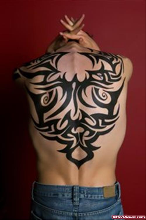 Awesome Black Ink Tribal Back Tattoo
