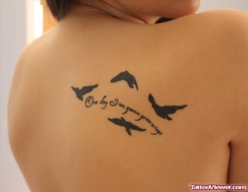 Black Ink Flying Birds And Lettering Back Tattoo