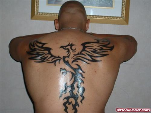 Black Ink Tribal Bird Tattoo On Back