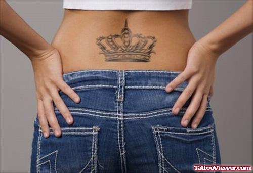 Grey Ink Crown Tattoo On Lowerback