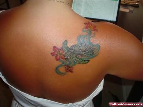 Flowers And Turtle Tattoo On Back