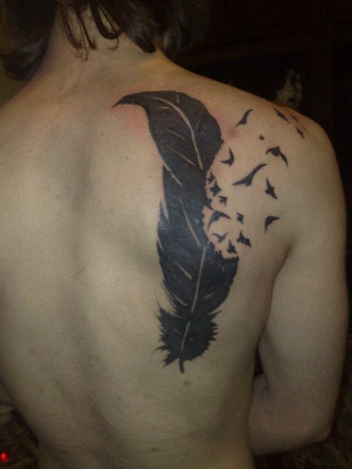 Amazing Black Ink Birds Flying From Feather Back Tattoo