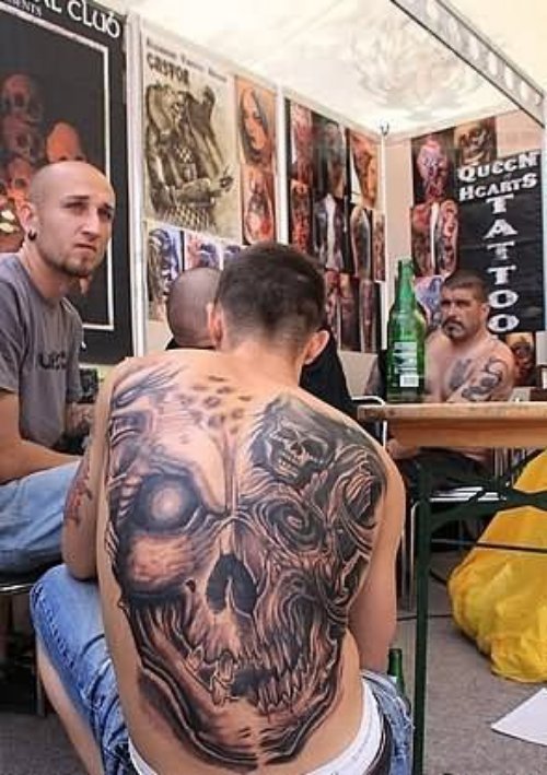 Grey Ink Skull Tattoo On Back