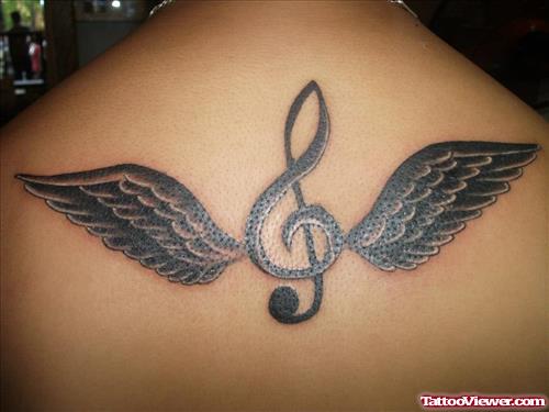 treble clef with wings tattoo on back
