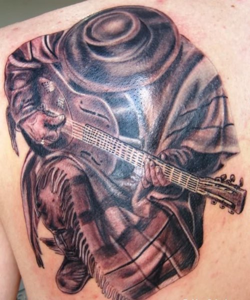 Band Man Playing Guitar Tattoo On Back