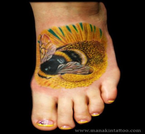 Colored Bee Tattoo On Left Foot