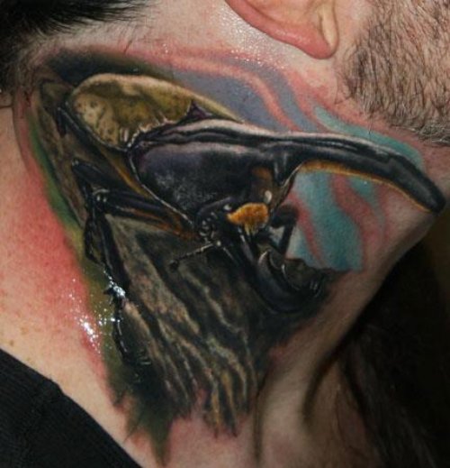 Colored Beetle Tattoo On Man Neck