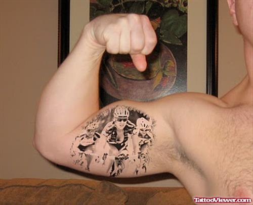 Byk Racer Tattoo On Biceps