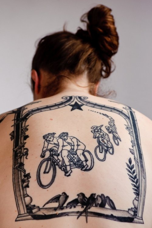 Girl With Biker Tattoo On Upperback