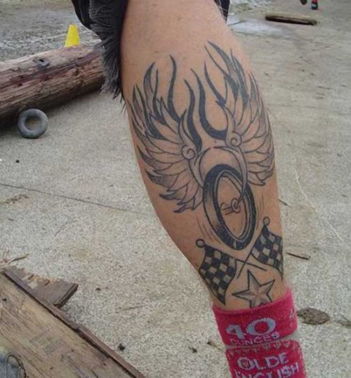 Winged Motorcycle Wheel Tattoo On Back Leg