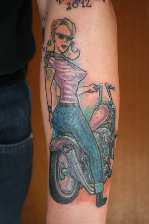 Colored Ink Biker Girl Tattoo On Sleeve