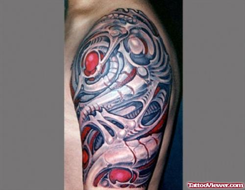 Colored Ink Biomechanical Tattoo On Left Half Sleeve