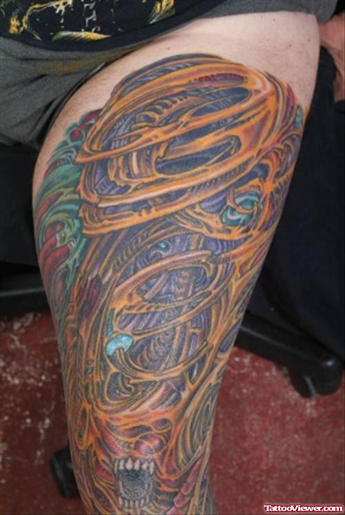 Colored Biomechanical Tattoo On Man Left Thigh