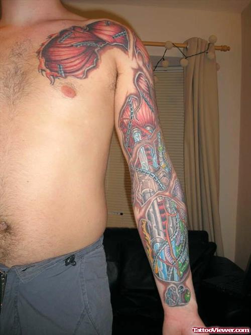 Colored Biomechanical Tattoo On Man Left Sleeve