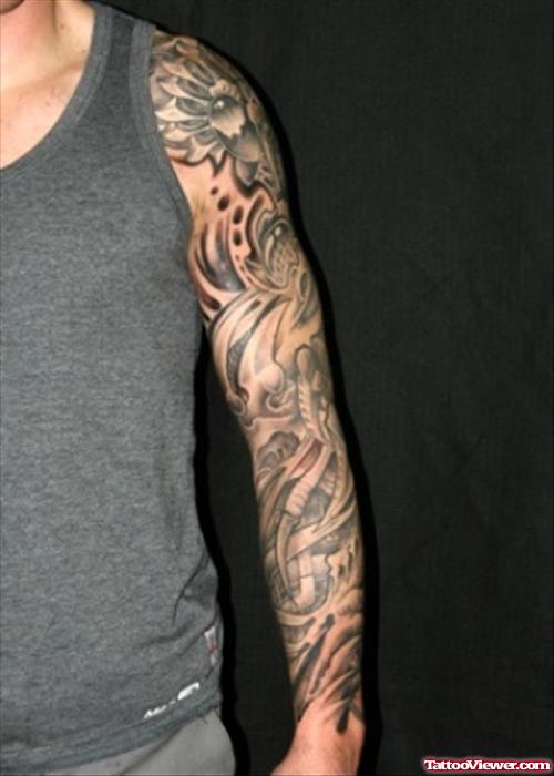 Grey Ink Biomechanical Tattoo On Man Left Sleeve