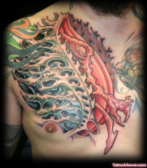 Colored Ink Biomechanical Tattoo On Man Chest