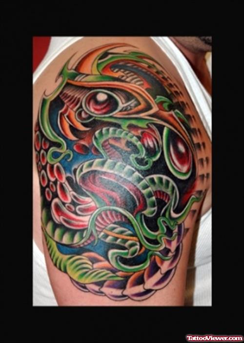 Green And Red Ink Biomechanical Tattoo On Right Shoulder