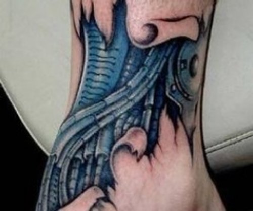 Blue Ink Biomechanical Tattoo On Ankle