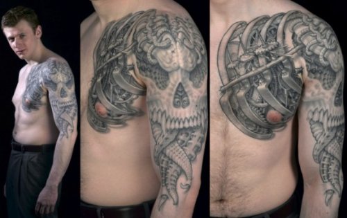 Grey Ink Biomechanical Tattoo On Chest And Left sleeve