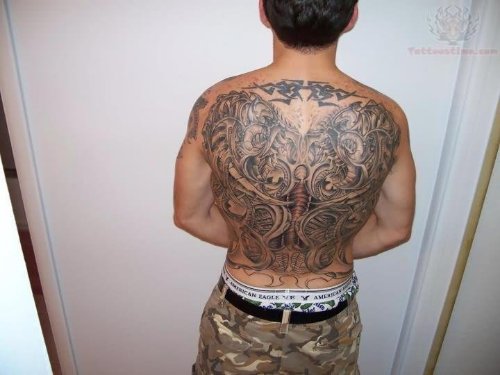Biomechanical Tribal Tattoo On Back