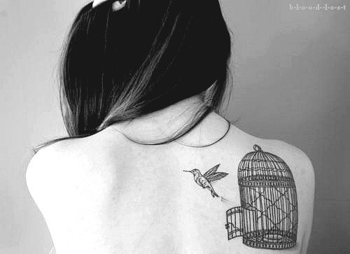 Bird Flying From Cage Tattoo On Back