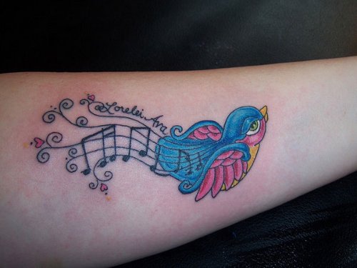 Color Music Notes And Bird Tattoo On Arm