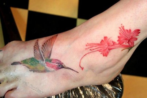 Pink Flower And Flying Hummingbird Tattoo