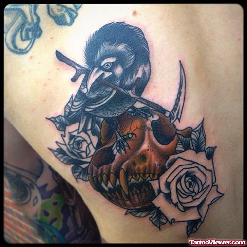 bird with scythe on skull tattoo