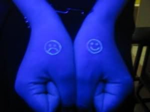Sad And Smiley Emotics Black Light Tattoos On Hands