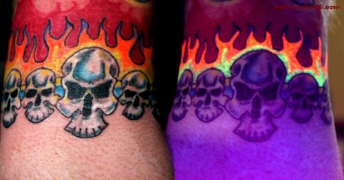 Flaming Skulls Black Light Tattoos On Wrists