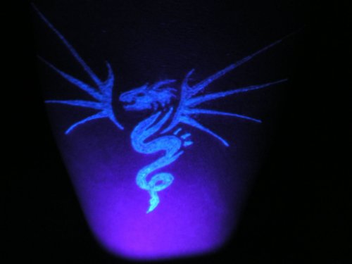 Black Light Dragon Tattoo On Leg