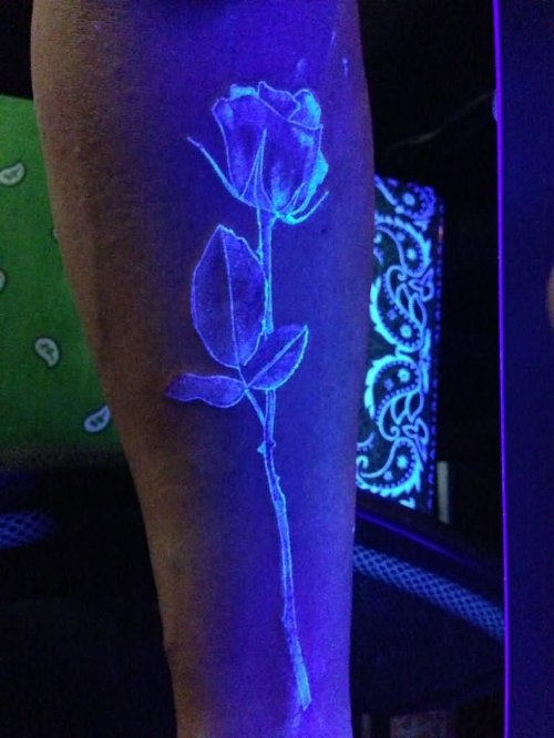 Black Light Flower Tattoo On Leg