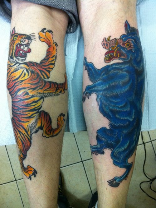 Tiger and Boar Tattoos On Back Legs