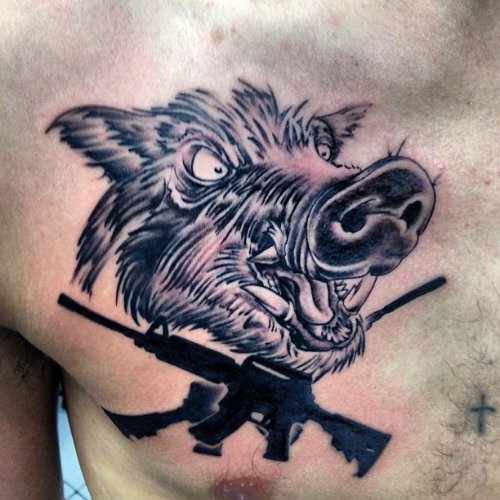 Black Guns And Boar Head Tattoo On Man Chest