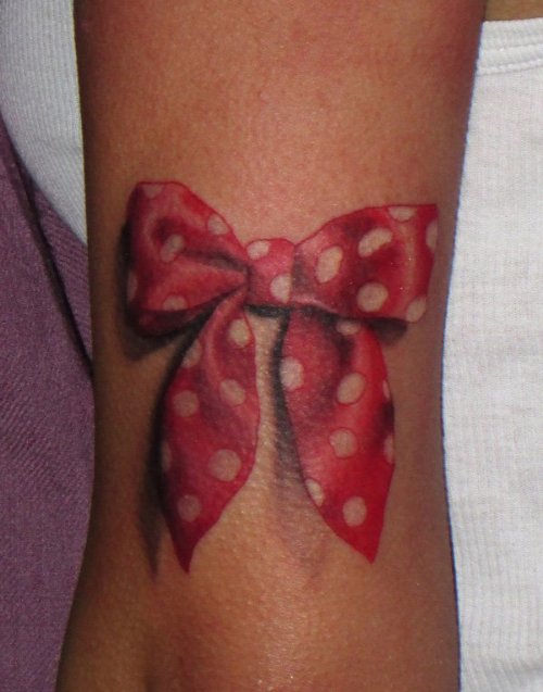 Red Bow With White Dots Tattoo On Leg