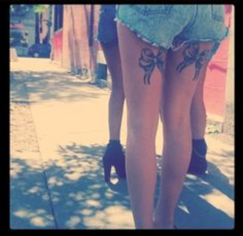 Amazing Back Thigh Bow Tattoos For Girls