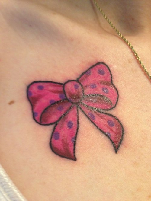 Pink Bow Tattoo On Girl Front Shoulders