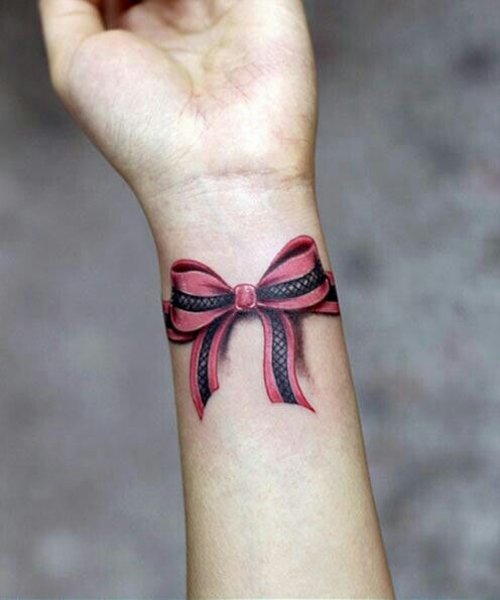 Awesome Bow Tattoo On Girl Left Wrist
