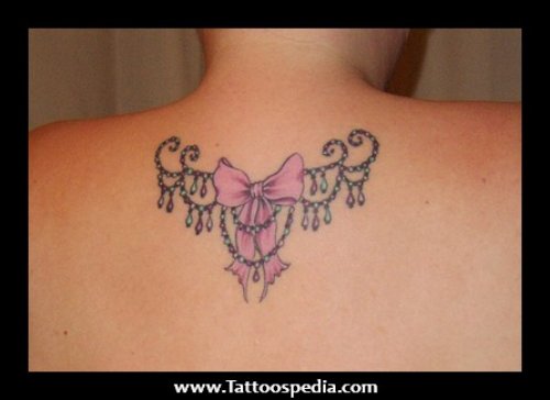 Pink Bow Tattoo On Upperback