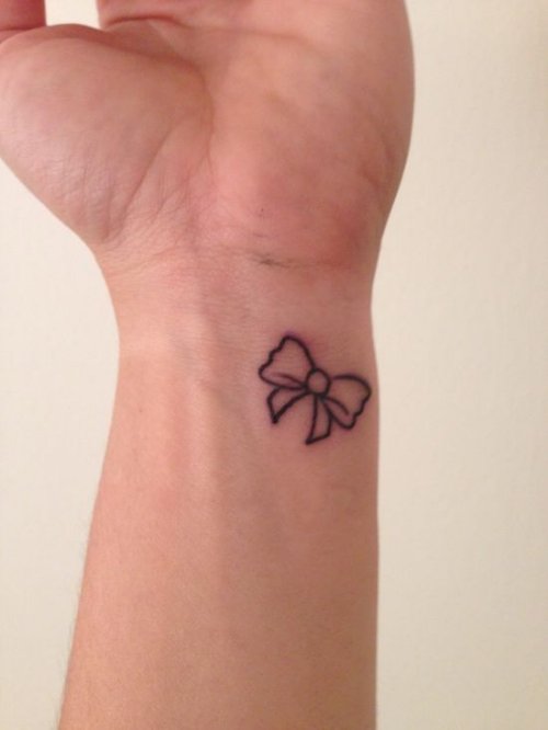 Small Outline Bow Tattoo On Wrist