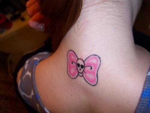 Skull Pink Bow Tattoo On Upperback
