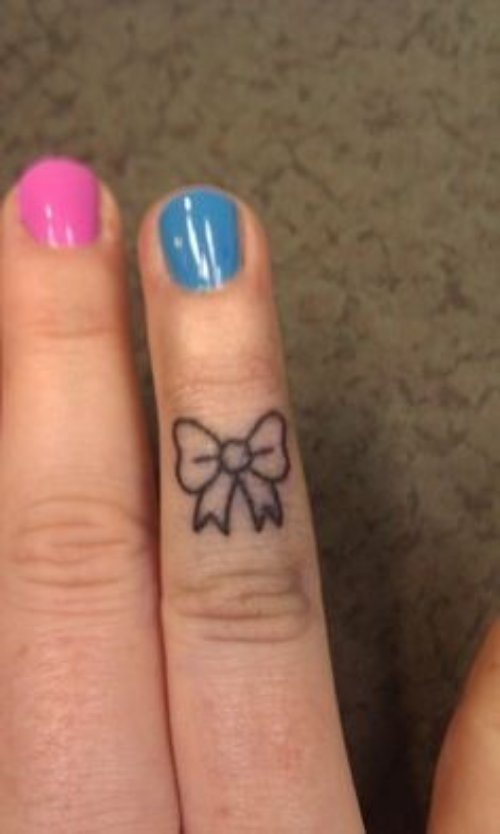 Tiny Bow Tattoo On Finger