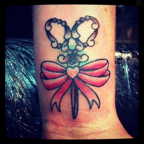 Scissor and Pink Bow Tattoo On Wrist