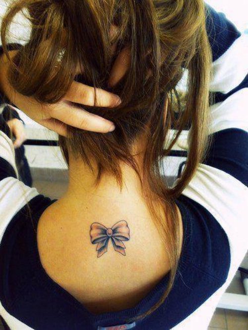 Girl showing Bow Tattoo On Upperback