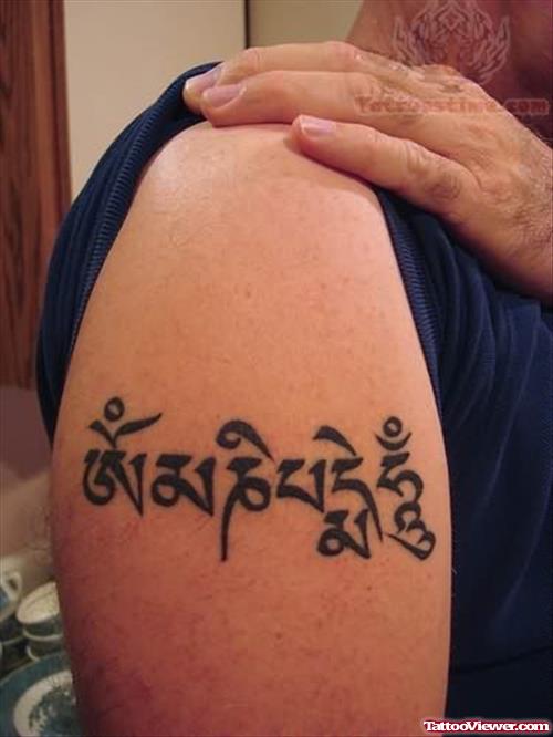 Buddhist Religious Tattoo On Bicep