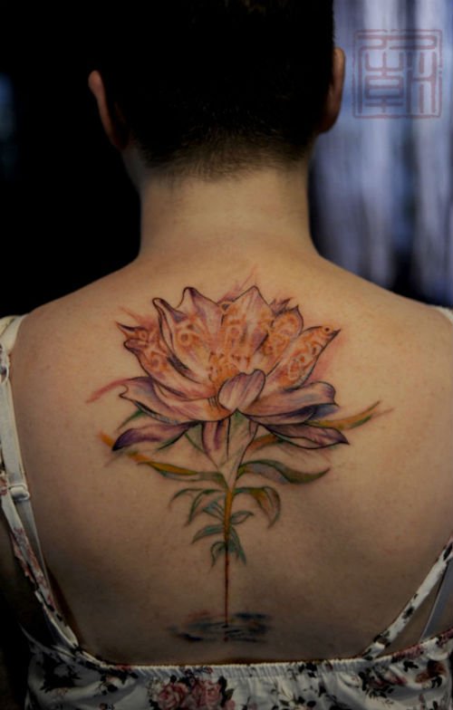 Buddhist Tattoo On Upperback