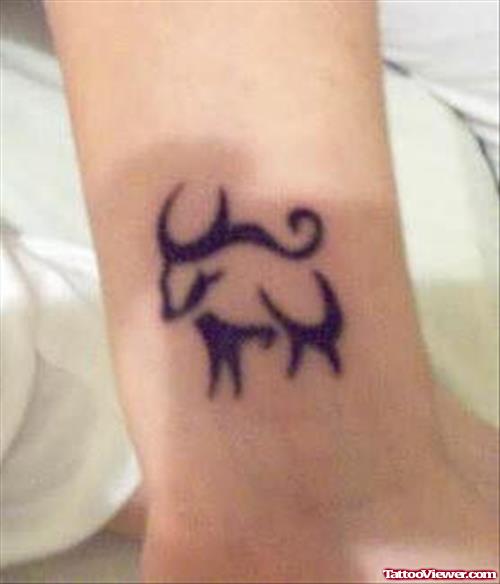 Tiny Bull Tattoo On Wrist