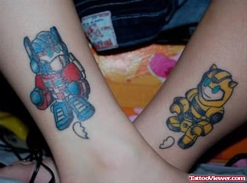 Baby Optimus Prime and Bumble Bee Tattoo