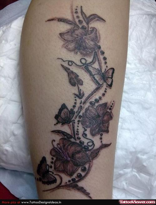 Grey Ink Flowers And Butterflies Tattoo