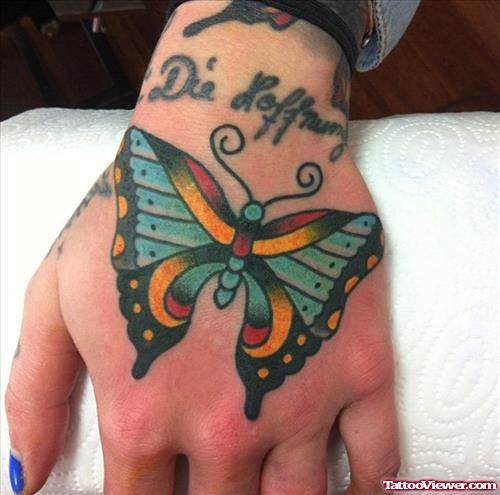 Colored Ink Butterfly Tattoo On Left Hand